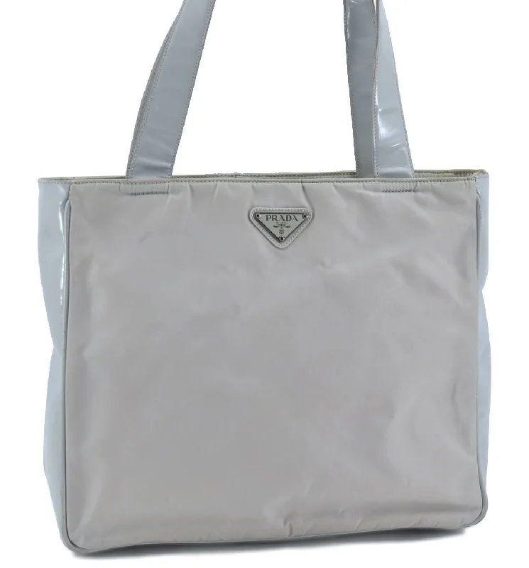 Prada Cahier bags with a monogram - embossed leather surfaceAuthentic PRADA Nylon Shoulder Tote Bag Light Gray H1446