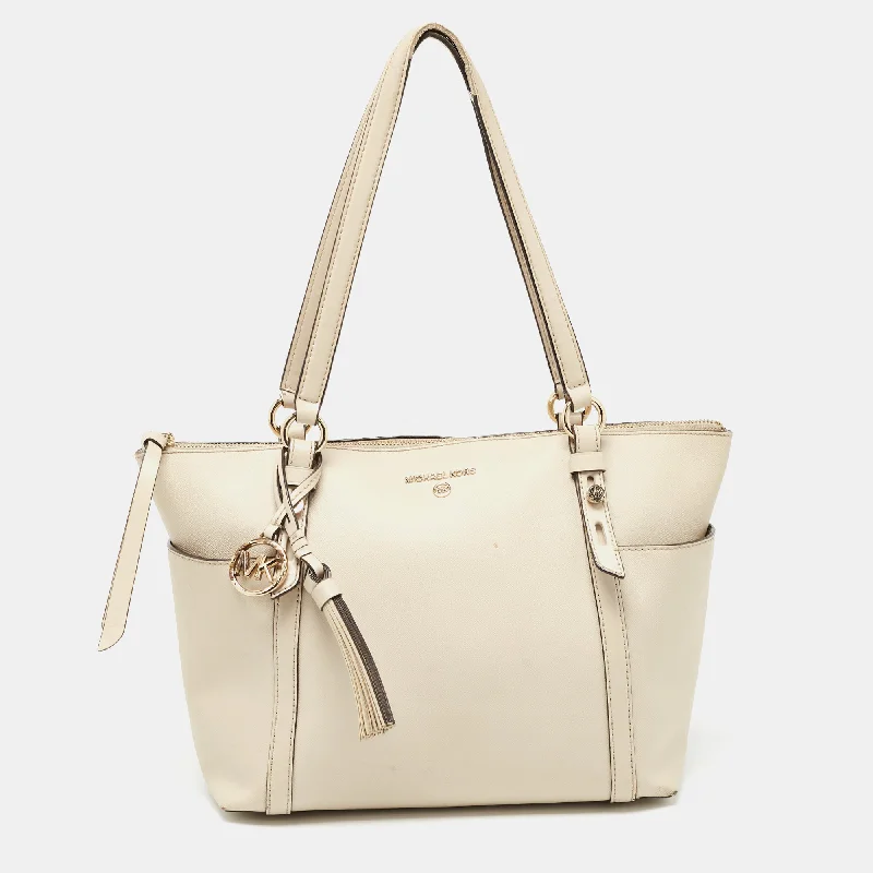 silver - accented Michael Michael Kors handbags for a modern edgeLight Beige Leather Medium Top Zip Jet Set Tote